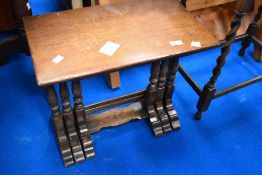 A reproduction nest of three tables, possibly Titchmarsh and Goodwin, width approx 52cm