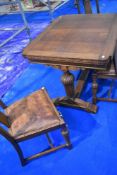 An early 20th Century oak drawer leaf table and matching set of four chairs, closed size approx. 106