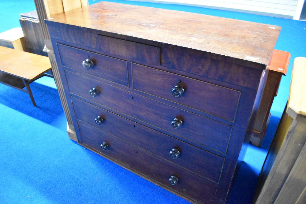 A Victorian mahogany chest of drawers, having concealed frieze drawer , two short and three long