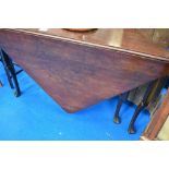 An early 20th Century mahogany gate leg table of triangular form, approx width 127cm