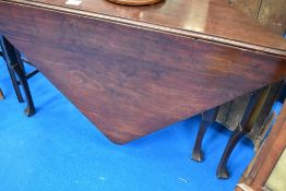 An early 20th Century mahogany gate leg table of triangular form, approx width 127cm