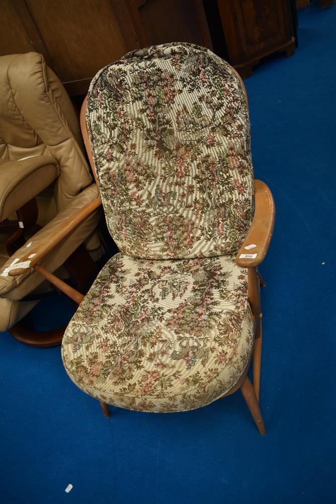 An Ercol style cottage armchair (unlabelled but remnants of label present at lower back)