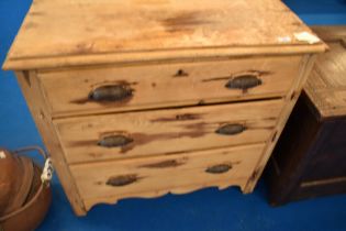 A stripped pine chest of three long drawers, width approx 80cm, depth 39, height 78cm