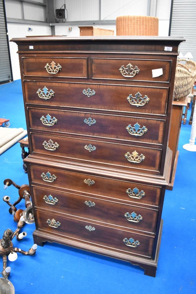 A nice quality reproduction chest on chest, in the Georgian style having large brass handles ,