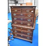 A nice quality reproduction chest on chest, in the Georgian style having large brass handles ,