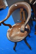 A Victorian oak office swivel chair