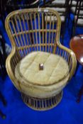 A vintage wicker stylised armchair