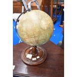 A vintage globe on stand , height approx. 45cm