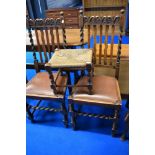 A pair of early 20th Century oak wave and rail back dining chairs having barley twist frames , and a