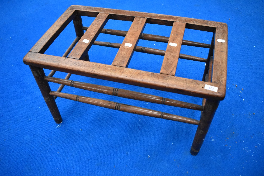 A Victorian mahogany luggage stand having turned frame