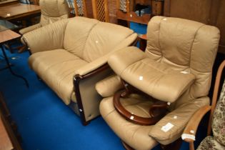 A Stressless lounge suite comprising settee, two armchairs and a footstool, in beige