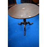 A 19th Century oak pedestal table, having circular on turned column with triple splay legs ,