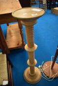 A pair of reproduction ladder back dining chairs and a beech jardiniere stand