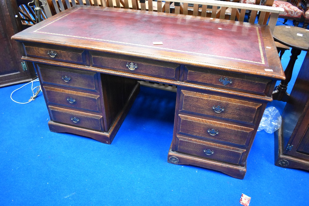 A nice qualty reproduction oak pedestal desk, by The Royal Oak Furniture Company, dimensions approx.