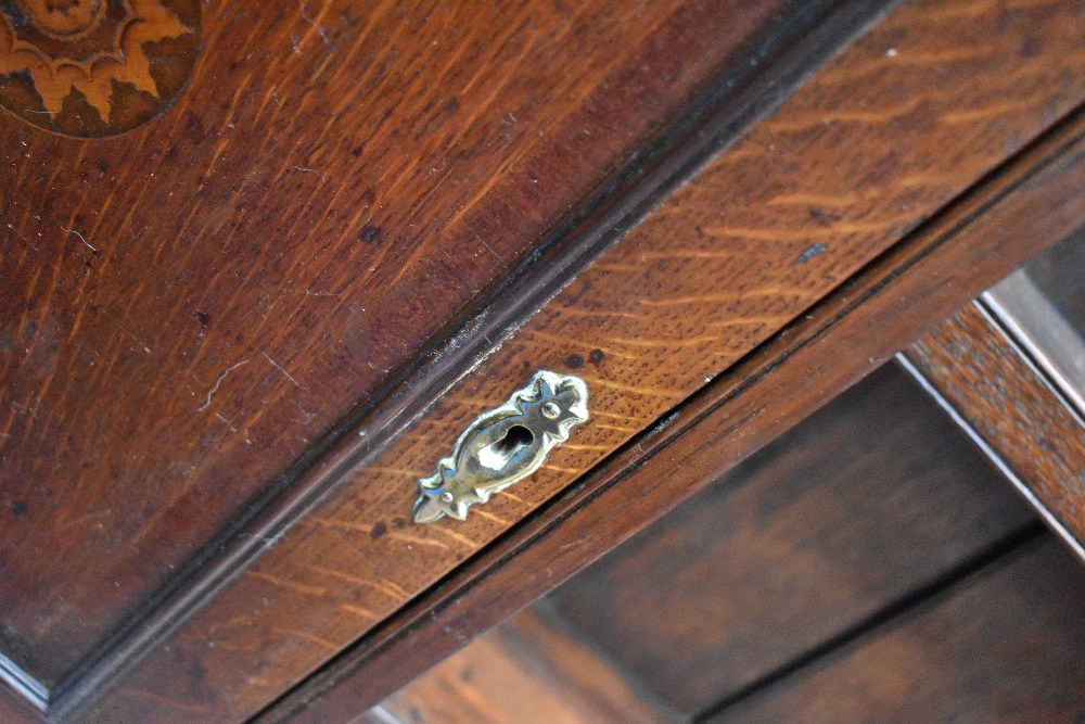 A period oak dresser having delft rack with shelves and cupboards to side , drawers to base on - Image 6 of 7