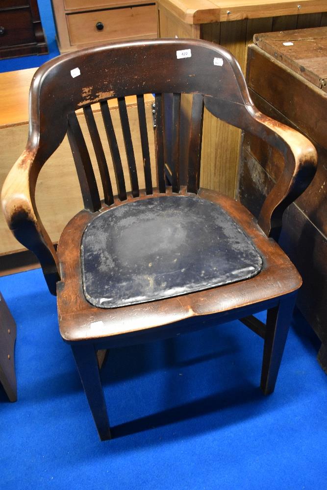 A late 19th or early 20th Century office armchair