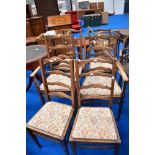 A set of six (four plus two) ladder back dining chair having drop in seats