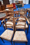 A set of six (four plus two) ladder back dining chair having drop in seats