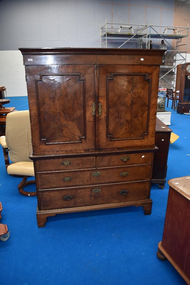 A 19th Century walnut and mahogany linen press having drawer base, width approx 127cm
