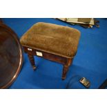 A Victorian mahogany dressing table or piano stool having turned legs