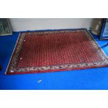 A traditional fireside rug, approx. 150 x 102cm
