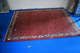 A traditional fireside rug, approx. 150 x 102cm