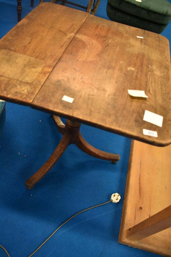 A Victorian mahogany pedestal table having rectangular snap top on turned column and triple splay