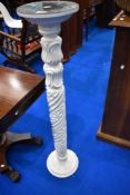 A reproduction painted jardiniere stand with faux marble top