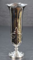 A George V silver vase of flared cylindrical form with lobed rim, foliage strapwork below raised