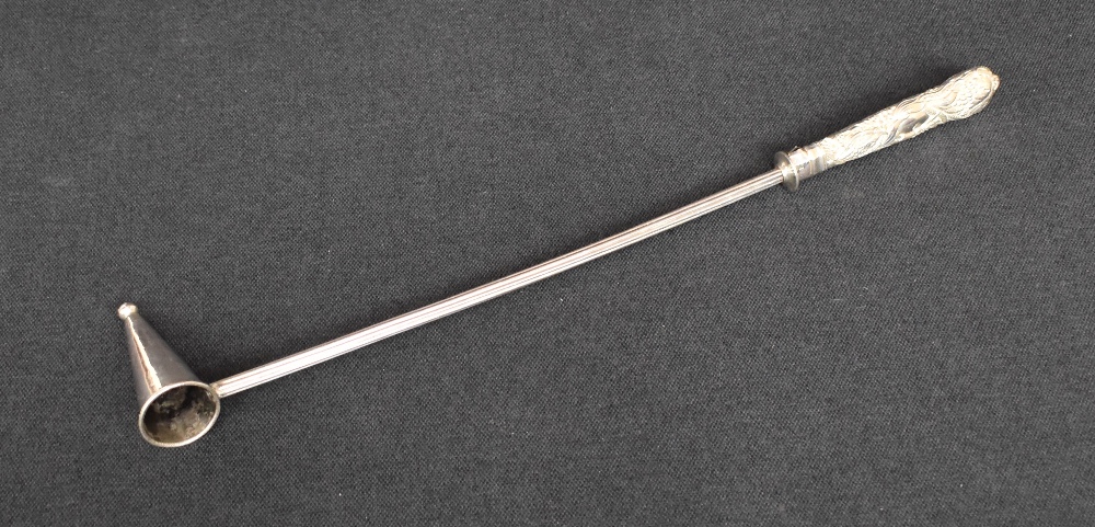 A 19th century silver and white metal candle snuffer, the silver embossed handle of a foliage design