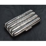 A Victorian silver cigar case, of lobed rectangular form to hold four cigars, having floral scroll