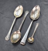A small group of silver spoons, comprising a pair of George V teaspoons having bead pattern and