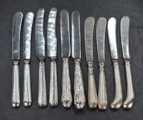 Five pairs of silver handled butter knives, of various form and design, marks for Sheffield 1910,