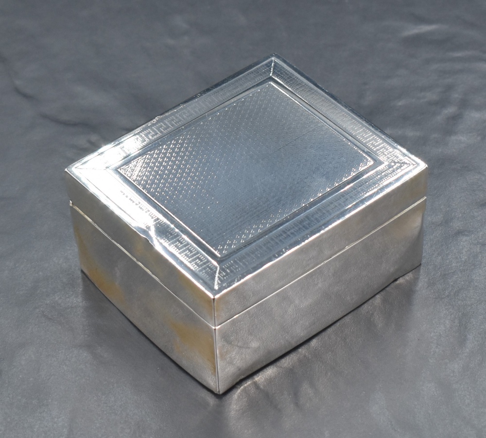 A George V silver cigarette box, of hinged rectangular form with engine-turned decoration to the - Image 2 of 9