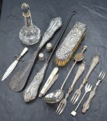 An assortment of silver and silver mounted items, including a sword motif book mark with mother-of-