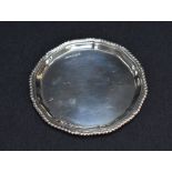 A George VI silver business or calling card tray, having a gadrooned rim and conforming lobbed petal