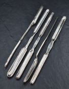 A group of five silver-plated marrow scoops, each of traditional design, one marked with circular