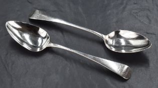 A pair of George III silver serving spoons, Old English pattern with engraved initials IL, marks for