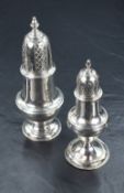 A George III silver sugar caster of traditional design with pierced triangular engraved finial