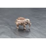 An Edwardian silver novelty pin cushion modelled as an elephant having dark fabric to the back,