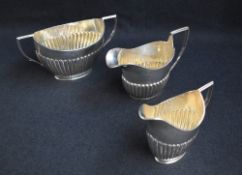 A group of three Victorian silver tea wares, comprising a sugar, milk and cream each of oval half-