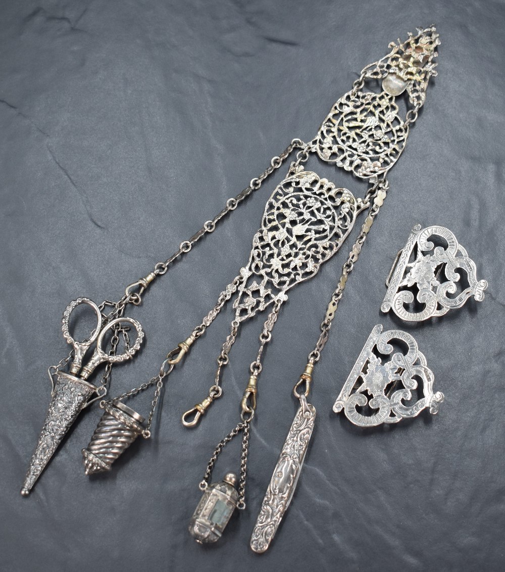 A Victorian silver chatelaine having three articulated moulded and pierced sections suspending - Image 2 of 4