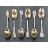 A cased set of six George V silver teaspoons, having beaded trim and scroll decoration, marks for