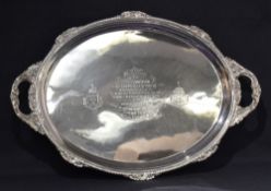 A large and impressive Victorian silver serving tray of oval form, having a gadrooned rim with