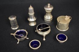 An assortment of silver tablewares, comprising a George V sugar caster of traditional form, marks