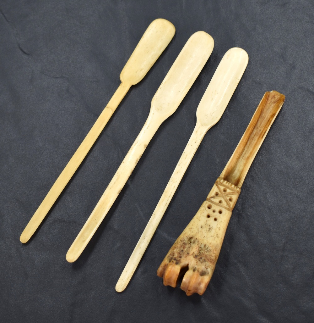 A group of four 18/19th century bone marrow scoops, three of traditional form, the other retaining