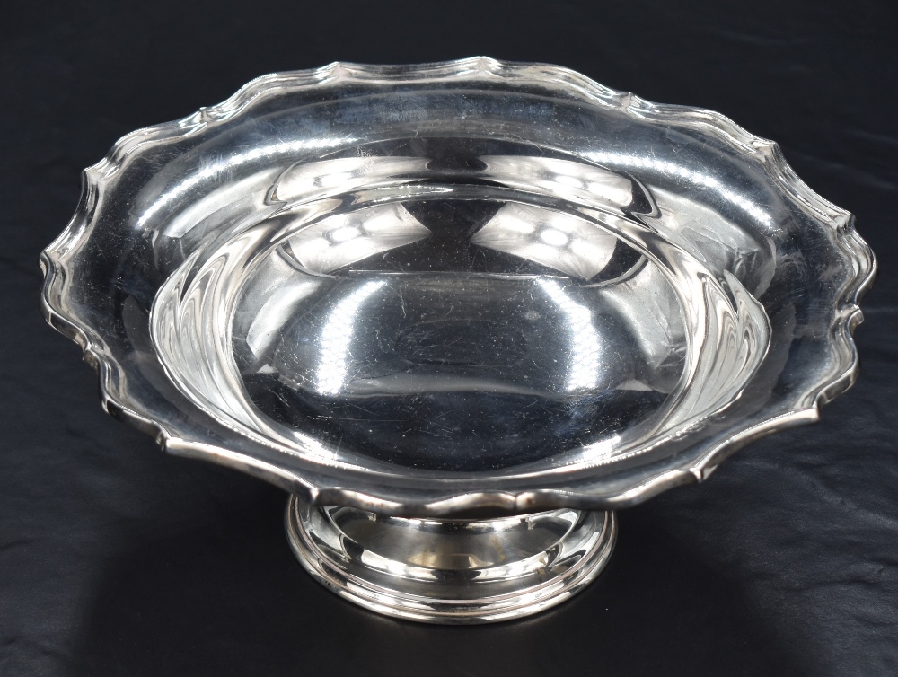 A George V silver pedestal dish of circular form with Chippendale influenced rim, marks for