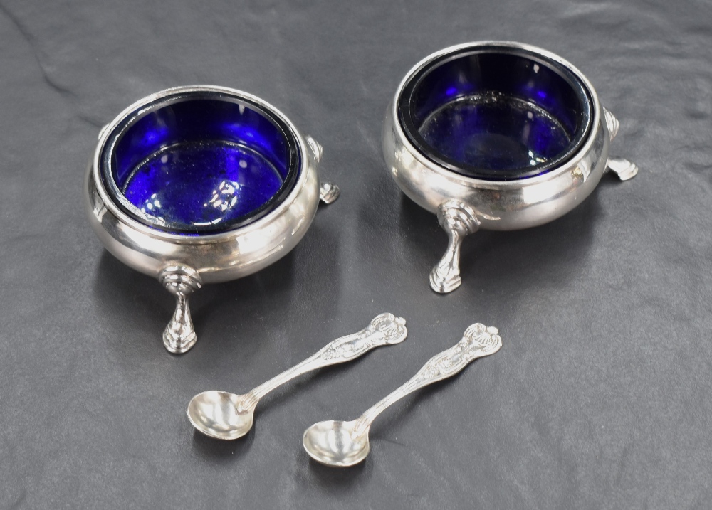 A pair of Victorian silver salts, of circular form with Bristol blue glass liners and stepped - Image 2 of 2
