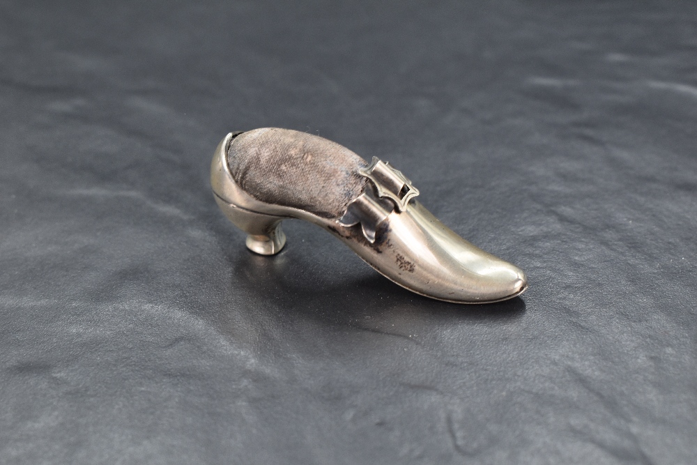 A late Victorian silver novelty pin cushion modelled as a shoe with a decorative buckle, having dark - Image 3 of 4