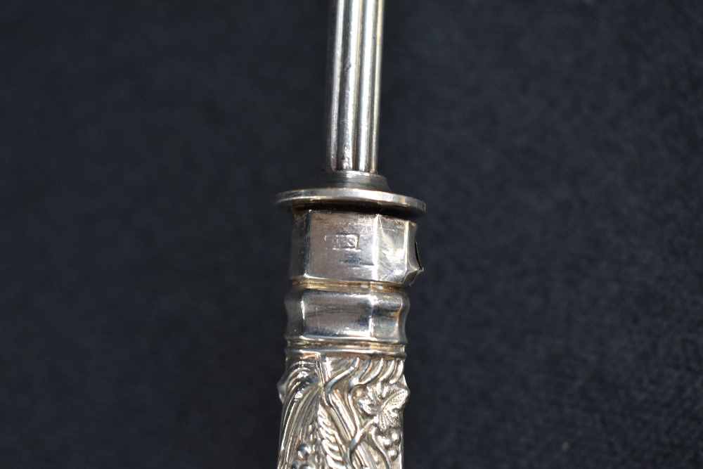 A 19th century silver and white metal candle snuffer, the silver embossed handle of a foliage design - Image 5 of 6